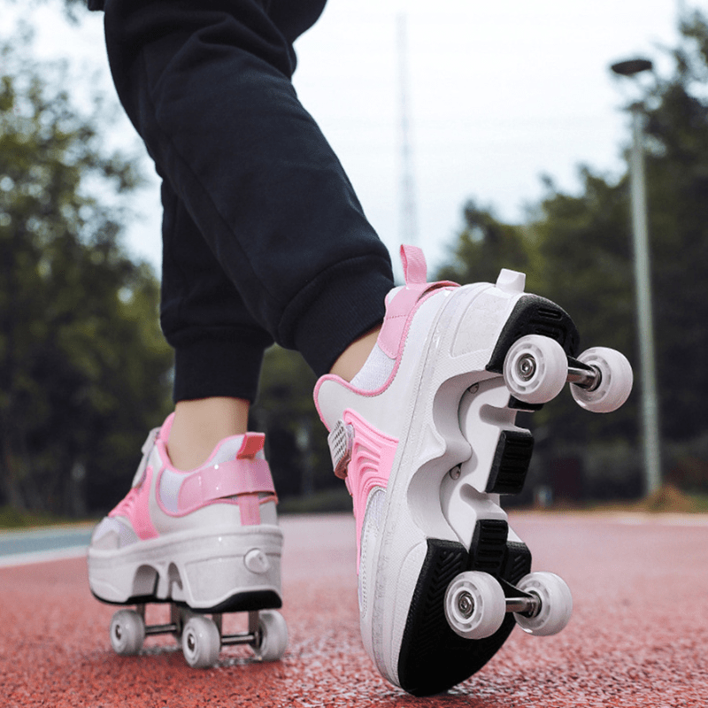back outdoor view of Kick Speed Pro-X LOW Roller Skate Shoes in pink and white showing dual wheel setup on red track surface