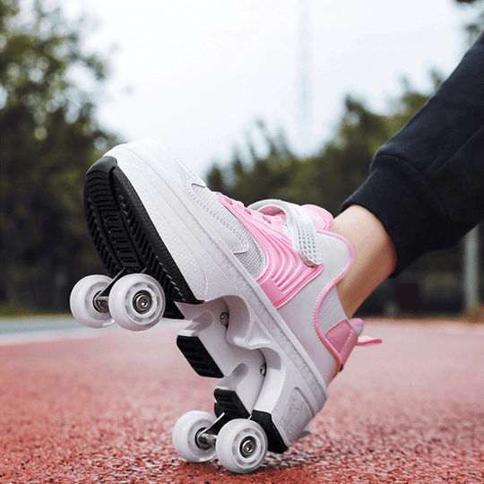 outdoor view of Kick Speed roller skate shoes in pink showing pop out wheels