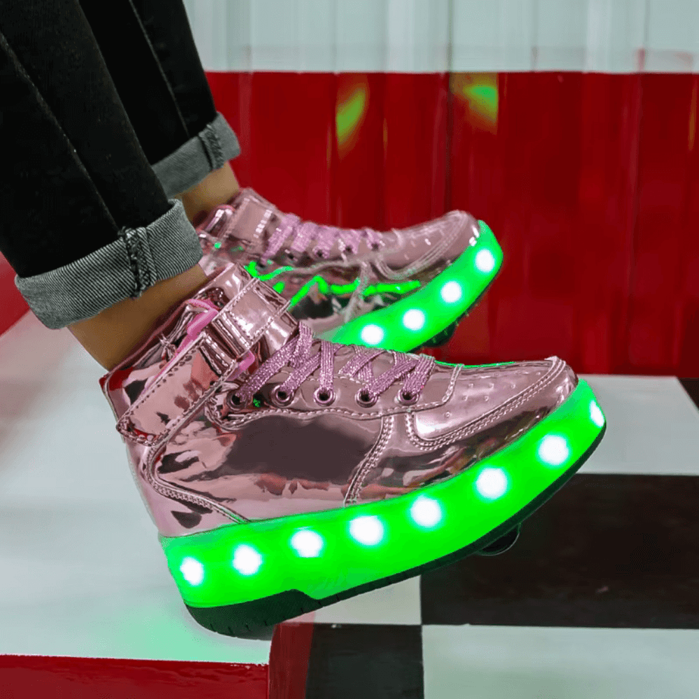 side view of girl wearing pink heel wheel roller shoes with LED lights worn indoors, shoes with wheels for kids