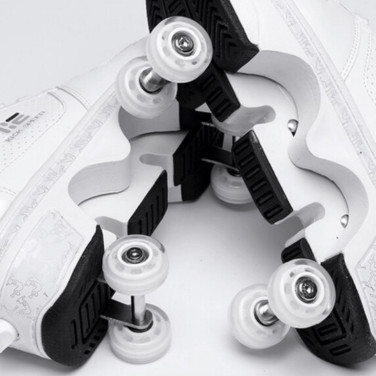 close-up view of retractable wheel system under Kick Speed white roller skate shoes, showing sole and wheel detail