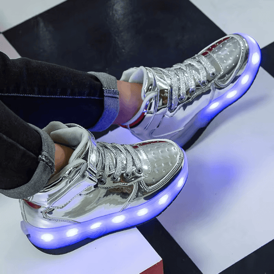 Silver heel wheel roller shoes glowing with purple LED lights on display