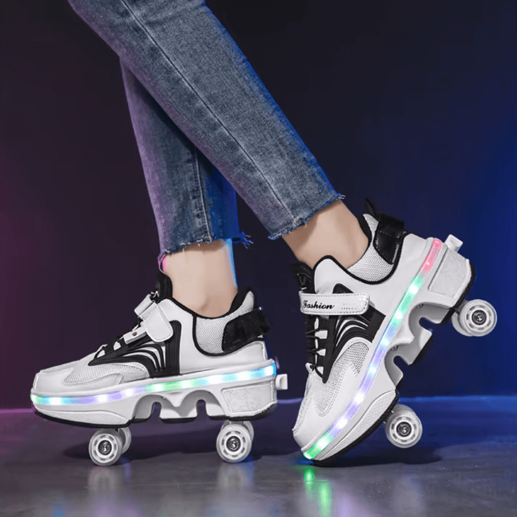 Side view of pink LED roller skate shoes with wheels while skating