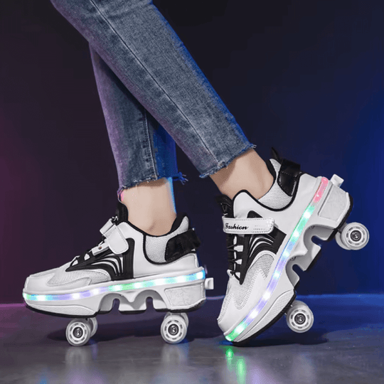 Side view of pink LED roller skate shoes with wheels while skating