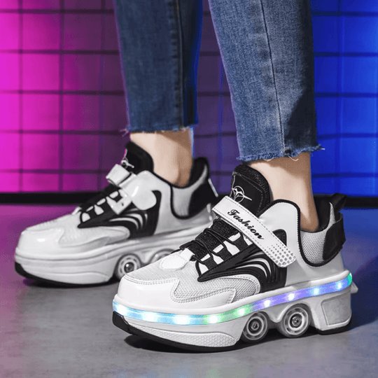 Close-up of black and white roller skate shoes with LED lights and wheels extended