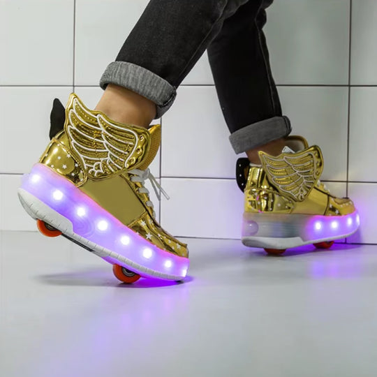 Gold winged roller shoes with LED lights on a tiled floor
