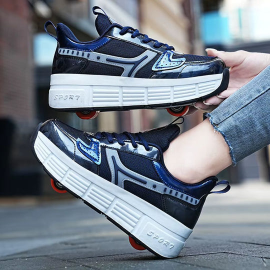 A pair of navy blue roller skate shoes with white platform soles and wheels, shown being worn with one shoe held in a hand and the other resting on a person's foot, against an outdoor blurred background