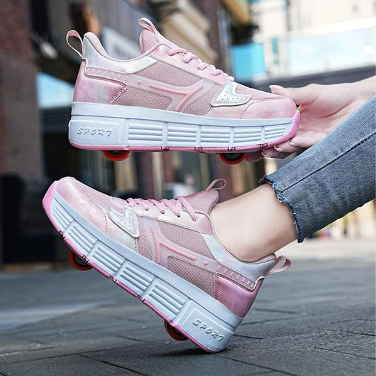 Pink roller skate shoes with wheels, shown being worn with one shoe on a foot and the other held by a hand against an outdoor urban background