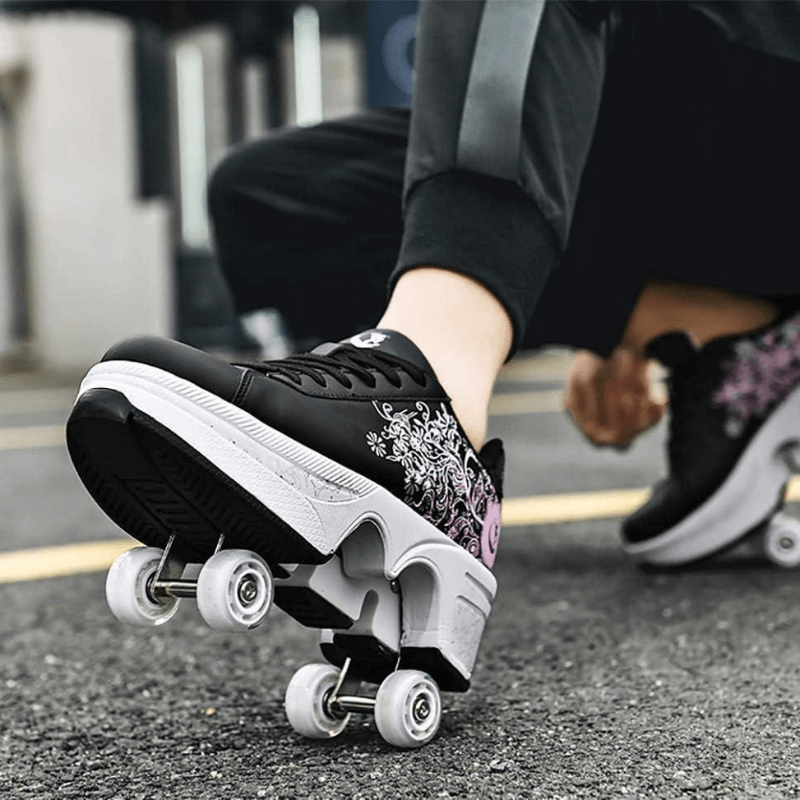 on feet Kick Speed floral roller skate shoes for kids in black and pink design and retractable wheels