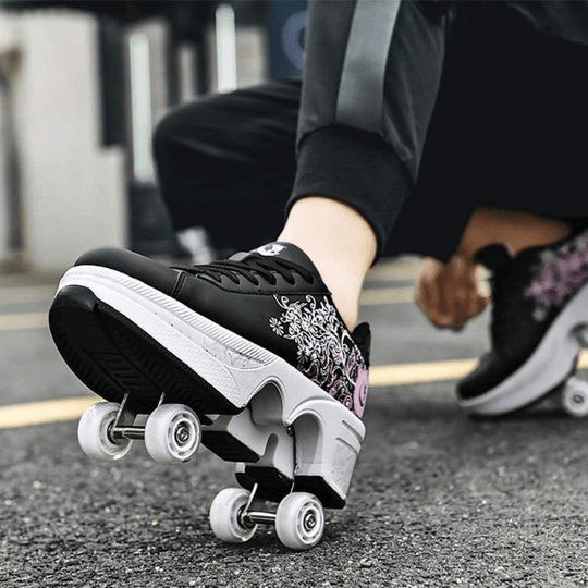 on feet Kick Speed floral roller skate shoes for kids in black and pink design and retractable wheels