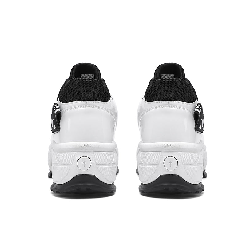 back view of Kick Speed Impact LOW black and white roller skate sneakers showing heel lock buttons