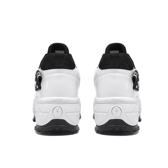back view of Kick Speed Impact LOW black and white roller skate sneakers showing heel lock buttons
