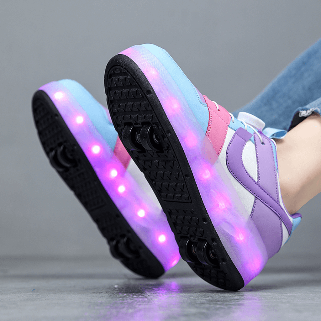 Underside of pink Kick Air LOW Heel Wheel Roller Shoes showing the front and rear wheel positions