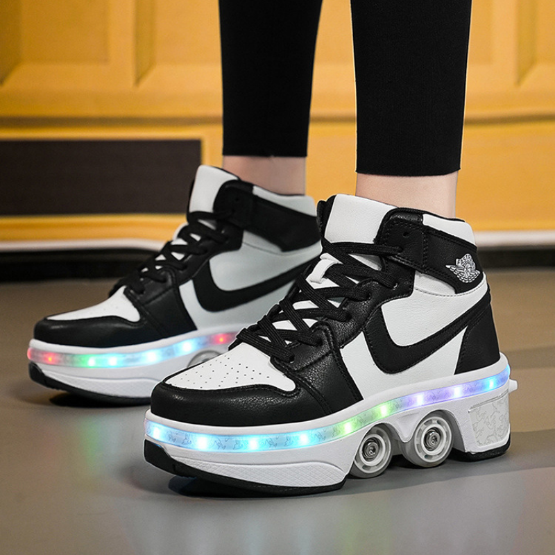 black and white LED roller skate shoes with pop out wheels, 4 wheel shoes for kids and adults glowing with colorful lights indoors