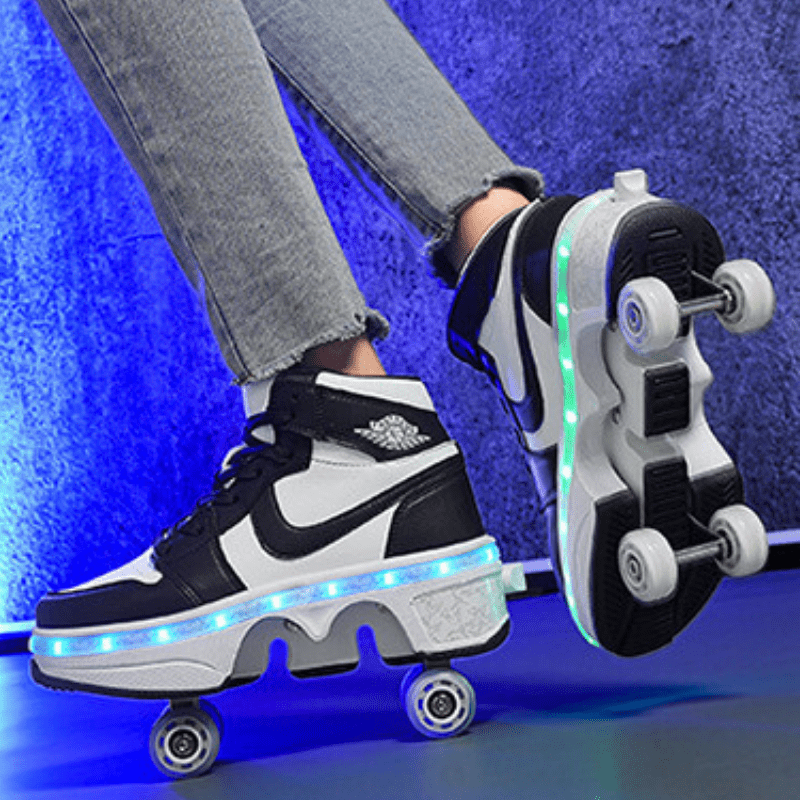 close-up of black Kick Speed LED roller skate shoes on floor, retractable wheels and bright sole lighting effect visible