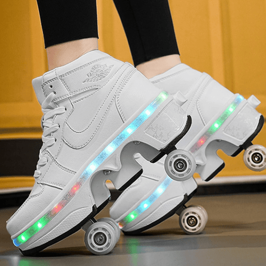 white LED roller skate shoes side view showing wheels in action, light-up roller shoes for kids with pop-out retractable wheels