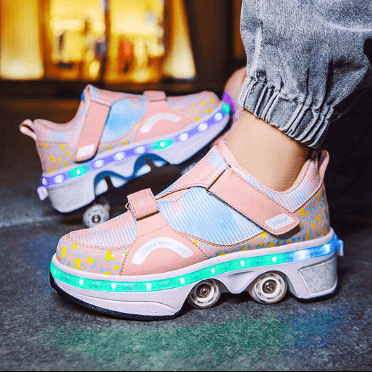 close-up of pink Kick Speed roller skate shoes for kids showing LED lights and retractable wheels