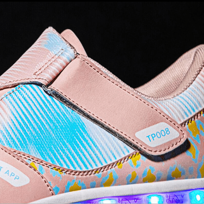 macro view showing Kick Speed pink roller shoes with mesh upper and smooth strap closure