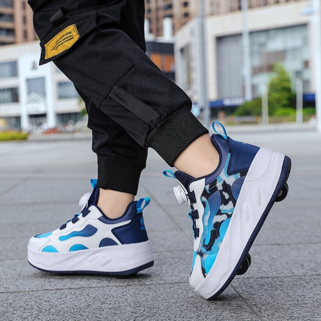 A person wearing blue camo roller shoes with black wheels, standing on a paved outdoor walkway