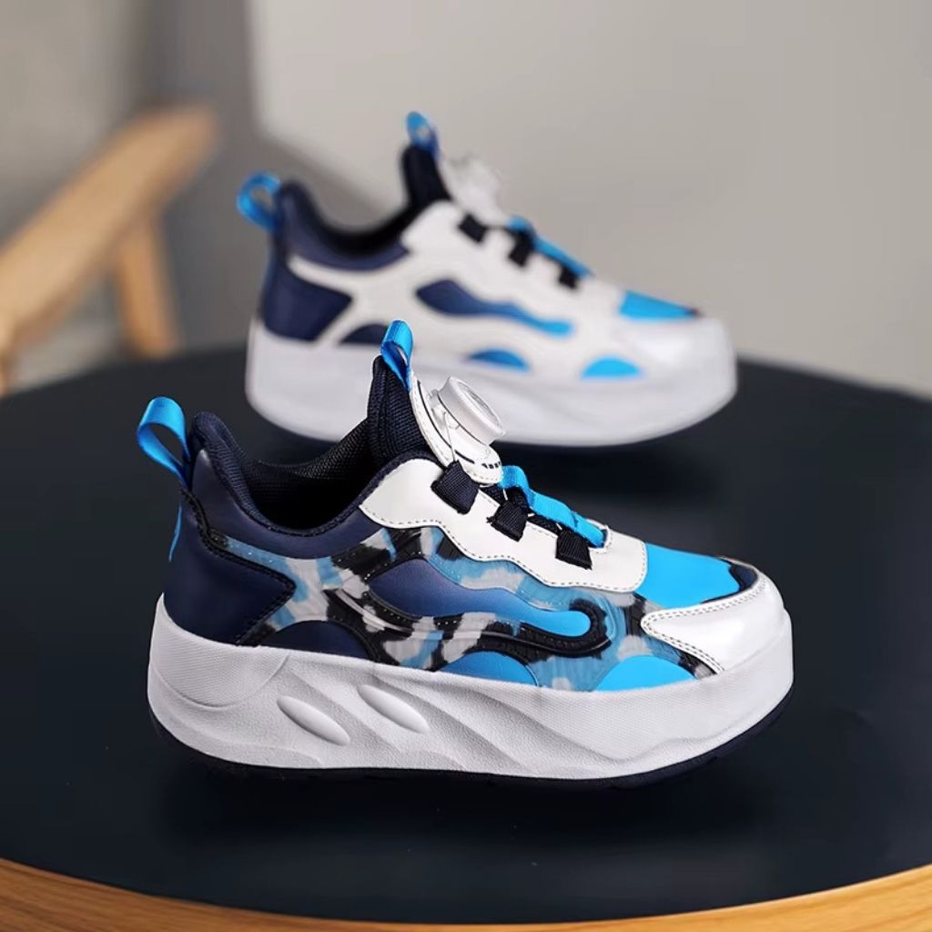 A pair of children's roller shoes with camouflage pattern, displayed on a dark round table