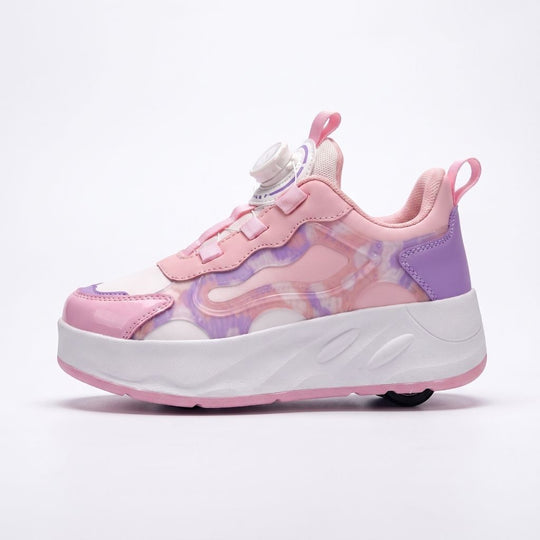 A pink children's roller shoes with a white sole, featuring a dial-up closure system, shown from the side on a light background