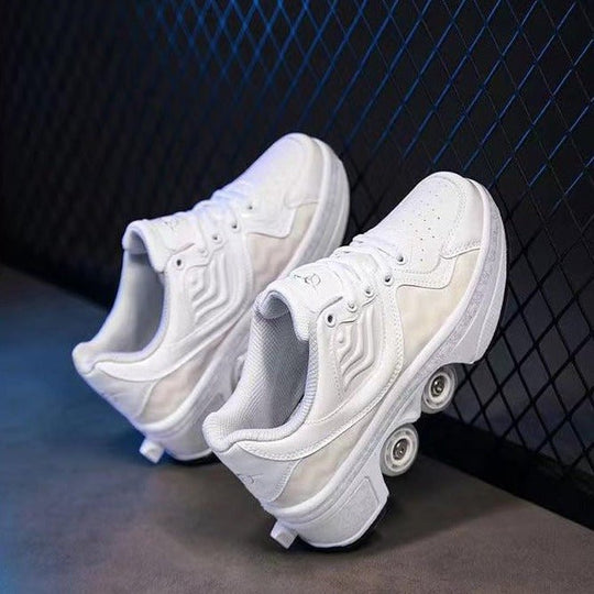 angled view of white Kick Speed Roller Skate Shoes with retractable wheels, placed on concrete floor against blue metal grid background, stylish roller shoes for adults and kids with glossy wavy side design