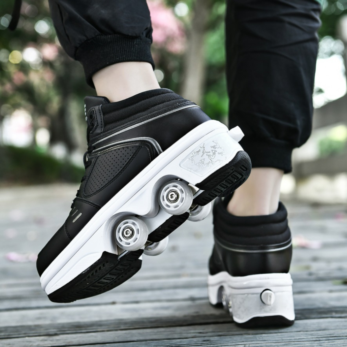 man wearing black Kick Speed roller skate shoes LED edition, close-up side view on wooden path outdoors
