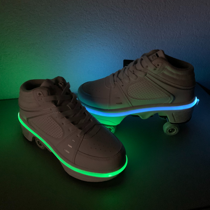 Kick Speed white roller skate shoes with retractable wheels glowing green and blue in customer photo