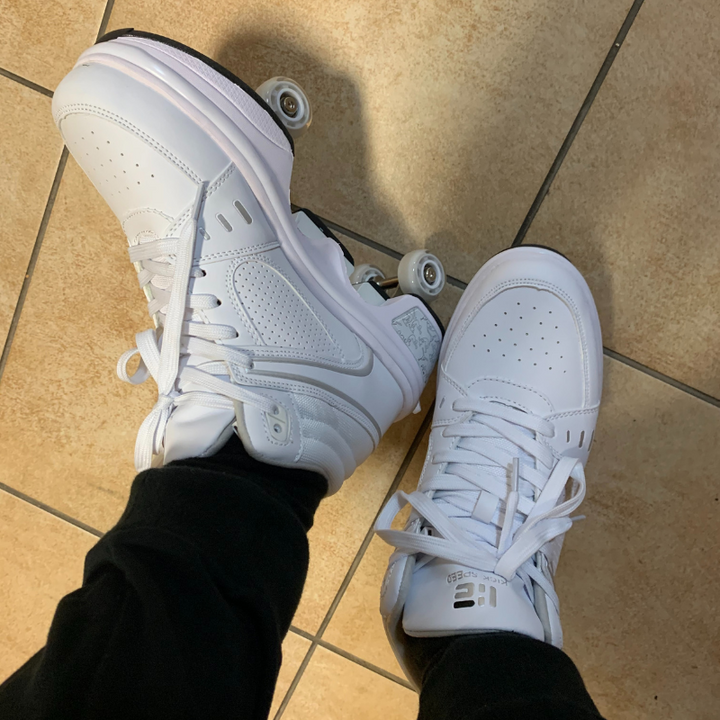 customer wearing white Kick Speed roller blade shoes with pop out retractable wheels