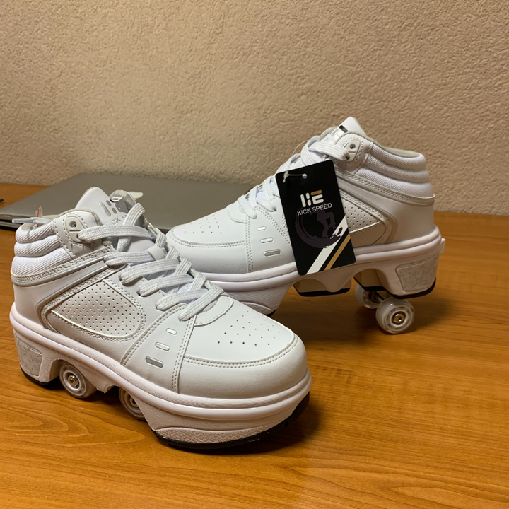 Kick Speed white roller skate shoes with retractable wheels and brand tag on desk