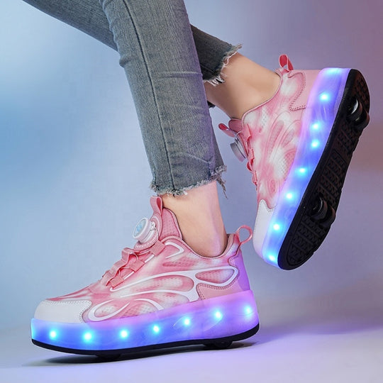 Pink Kick Speed LED sneakers with wheels worn with light gray jeans on a gradient background