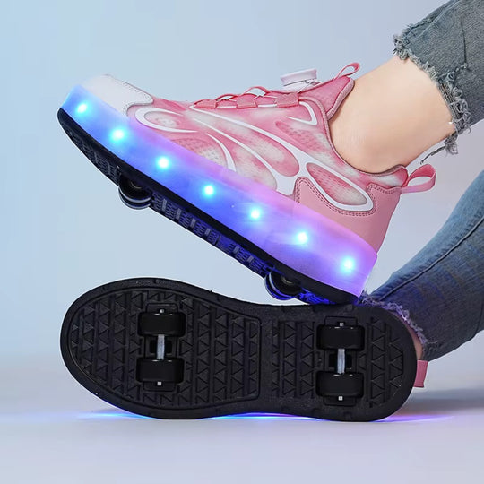 Pink LED sneakers with wheels on a light gray background