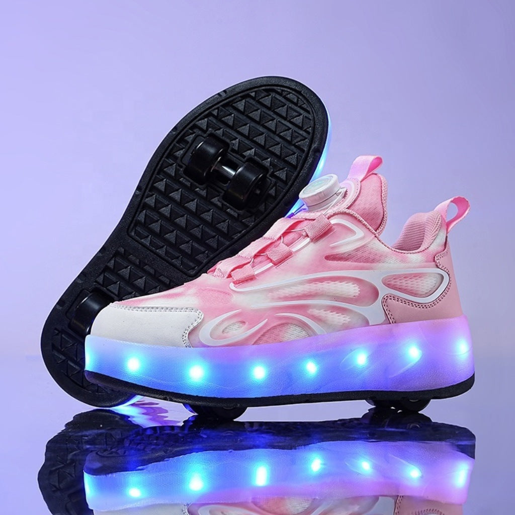 Pink roller shoes with LED lights on a reflective surface
