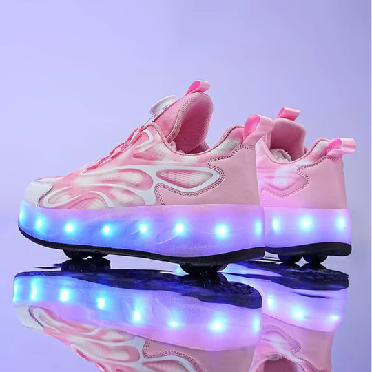 Pink children's roller sneakers with LED lights on a reflective surface