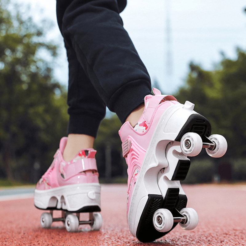 bottom view of pink Kick Speed roller shoes while skating, outdoor photo showing skate shoes for kids