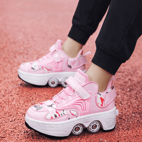 pink Kick Speed Pro-X Camo Edition LOW Roller Skate Shoes for kids being worn on red track, side outdoor perspective