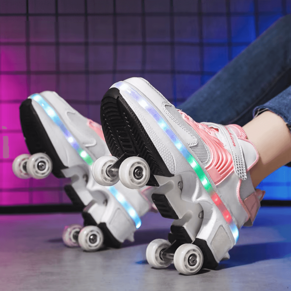 side view of pink retractable roller shoes showing illuminated sole, pop out wheels and LED lights