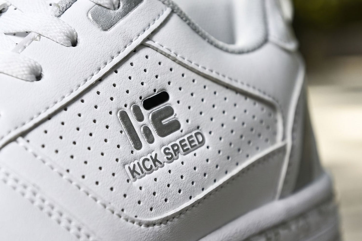 Close-up of a white Kick Speed roller shoe heel with the logo