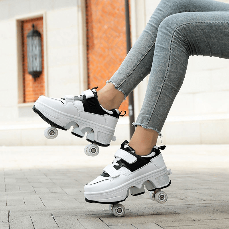 black and white Kick Speed roller skate shoes gliding outdoors with retractable wheels
