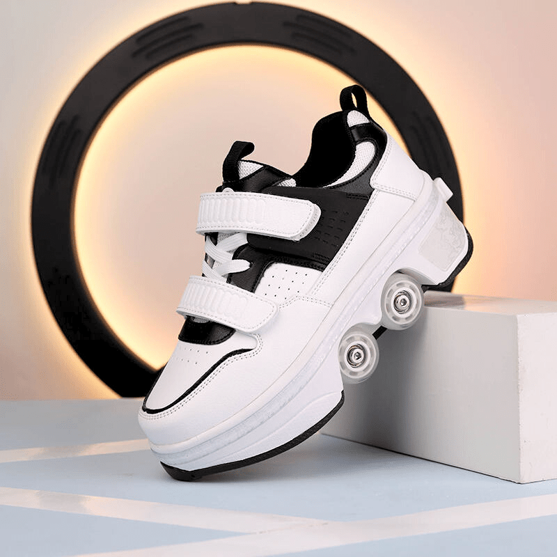 side angle of black low-top shoes with wheels on the bottom for kids