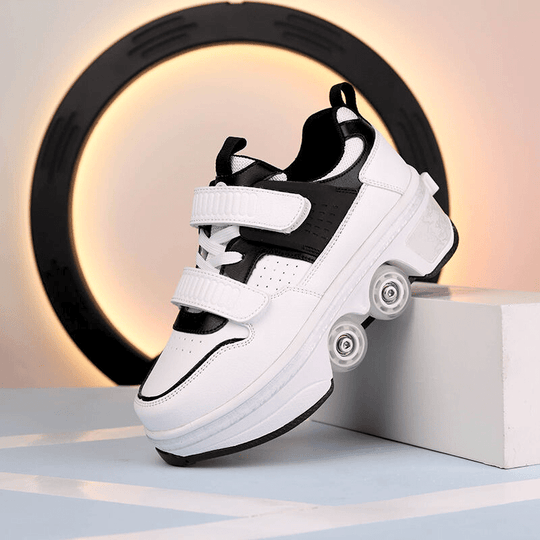 side angle of black low-top shoes with wheels on the bottom for kids