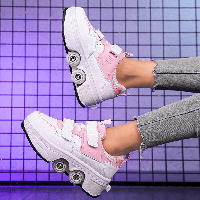 side angle of pink Kick Speed Supersonic LOW roller skate shoes mid-movement under soft lighting