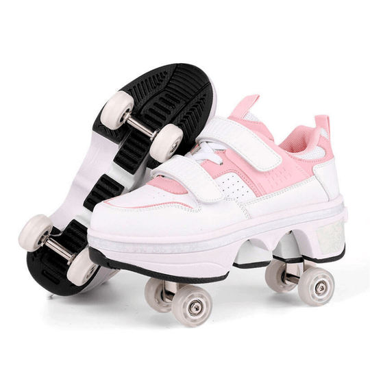 Kick Speed Supersonic LOW roller skate shoes in white and pink showing pop out wheels on the bottom on studio background