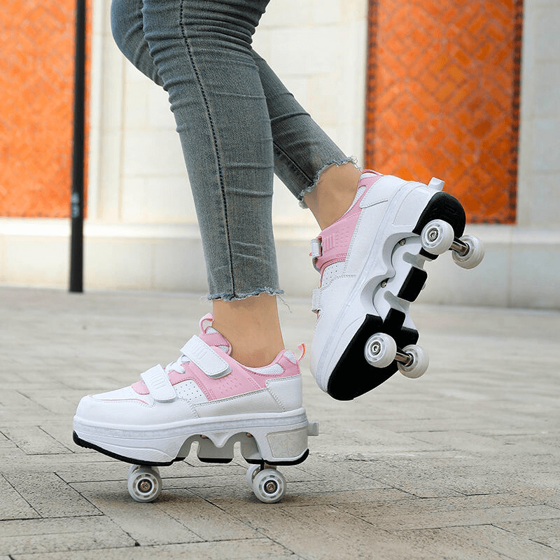 side view of pop-up wheel mechanism on pink and white roller skate shoes for women