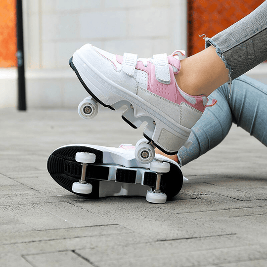 side view of pink roller skate shoes for women highlighting pop-up wheels and smooth outsole