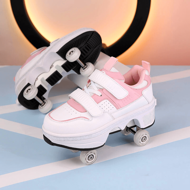 pink low-top roller shoes for kids positioned beside LED circle light on minimal background