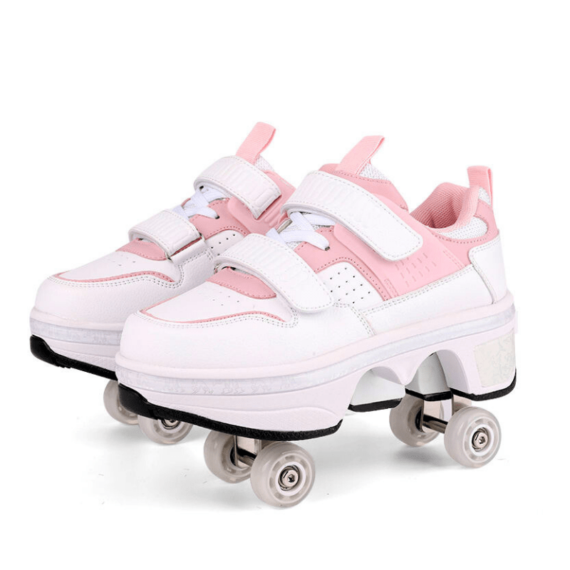 pair of pink and white low-top roller shoes for kids showing dual rear wheels