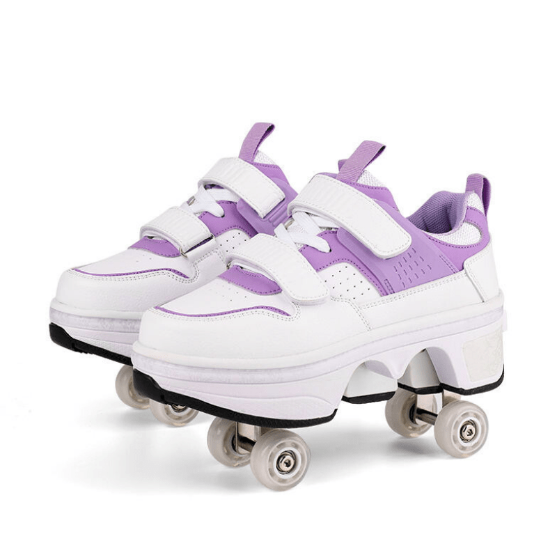 side view, pair of purple roller skate shoes with wheels for girls and adults on studio background