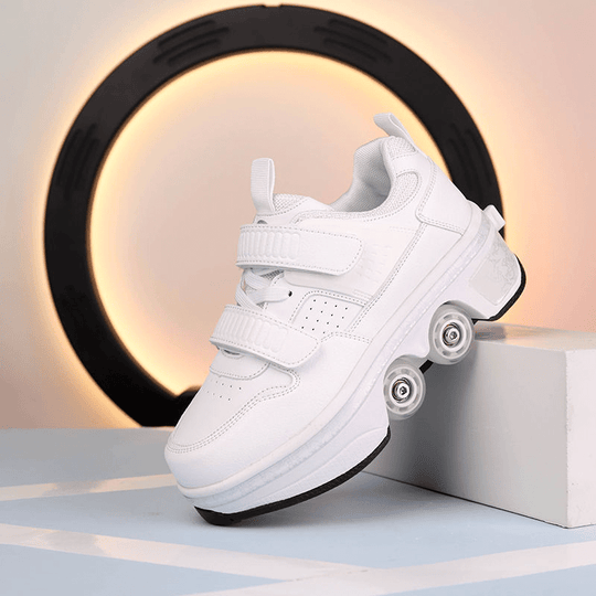 side view of white low-top roller skate shoes with pop-up wheels positioned on modern display
