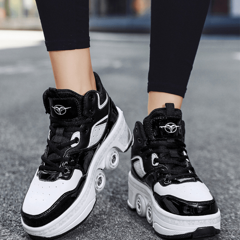 black and white roller skate shoes front view, pop-out wheel mechanism displayed while walking