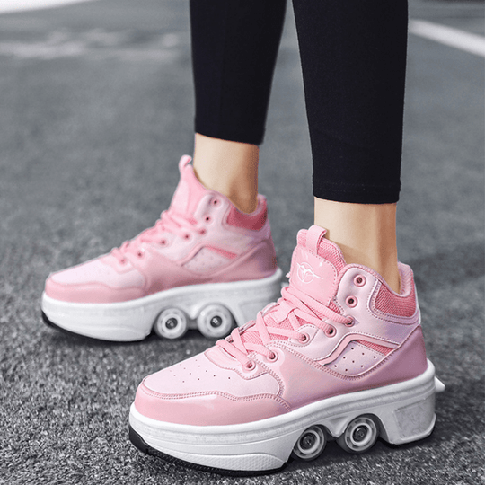 side view of pink Kick Speed roller skate shoes mid-top design on asphalt, comfortable roller shoes for kids with wheels